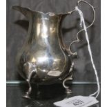 A Georgian silver cream jug on three pad feet, London 1769, 80 g