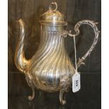 A French silver coffee pot of fluted decoration on four scrolled feet, 595 g