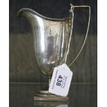 A silver helmet cream jug on square base, Sheffield 1904, 128 g