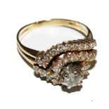 A lady's 14 carat gold diamond dress ring