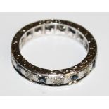 An 18 carat white gold sapphire and diamond eternity ring