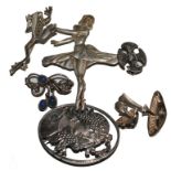 An assortment of six silver brooches depicting a ballerina, frog, girl etc