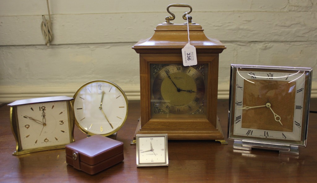 A Swiza Swiss brass cased eight-day mantle or table alarm clock, together with a Cutter & Block