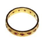 An 18 carat gold ruby set eternity ring