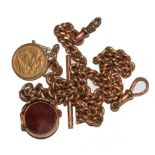 A gentleman's 9 carat gold double Albert with half-sovereign and spinning fob