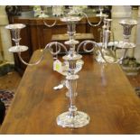 A pair of Georgian-style Adam-design two-branch table candelabra, together with a pair of matching