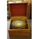 A ship's gimbal compass in hardwood carry case by Stanley, London