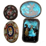 Two silver butterfly wing brooches, one depicting a Dutch boy and girl, the other a fairy playing