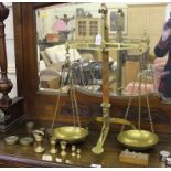 A vintage Lloyds Bank brass coin weighing scales, manufactured by Milward of Birmingham, complete