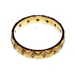 An 18 carat yellow gold diamond-set eternity ring