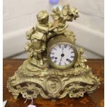 A 19th century French-style ormolu mantle clock with elaborate carving and profuse fret work,