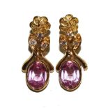 A pair of pink sapphire and white Cupid zirconia set drop earrings in 18 carat gold