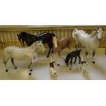 A selection of three Beswick horses, one foal and two beagles and one other unglazed ceramic