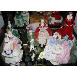 An assortment of six Royal Doulton figurines of ladies and gents