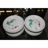 A pair of Chinese famille-rose saucer dishes