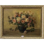 A.M, indistinctly signed, a good oil painting on canvas of roses in a green vase