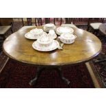 A Victorian oval veneered table, carved columns and feet, 70H x 40W x 106cmD