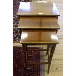 A nest of three Edwardian tables, the tallest 68cm high