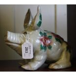 A Wemyss style pig, decorated in pink roses and green leaves. 23cm long