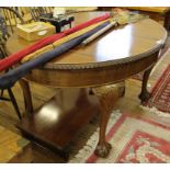 A Victorian mahogany oval table with claw and ball feet, centre leaf with a winder, 78H x 130W x
