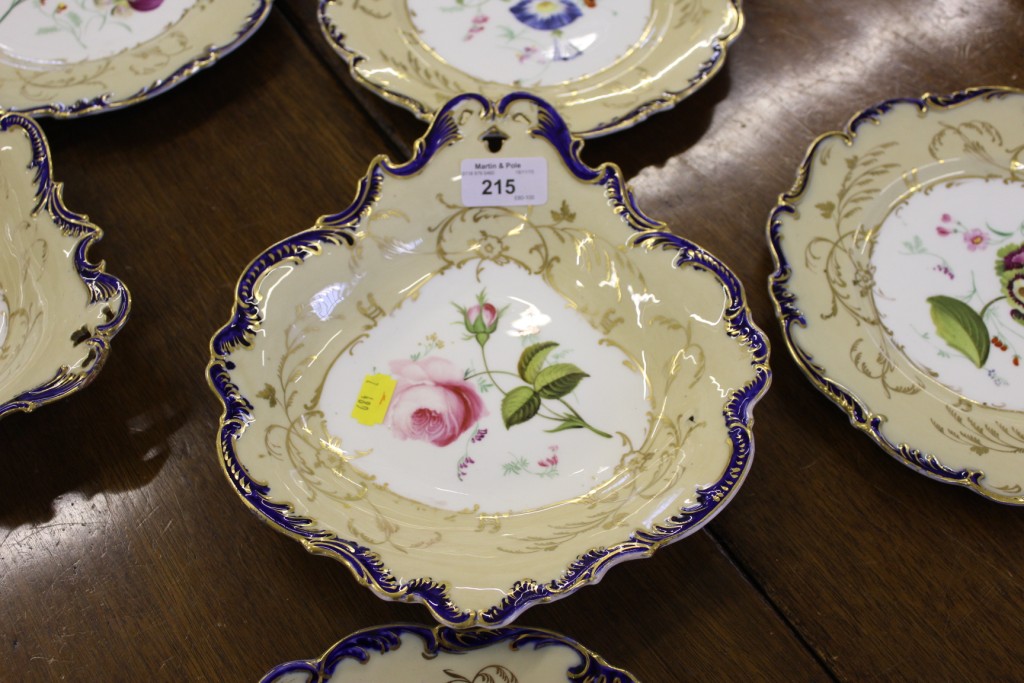 An English 19th century porcelain set of three dishes and six plates
