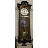 A 19th century-style mahogany and lacquered Viennese wall clock with shaped cornice, fluted