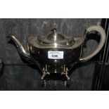 A silver plated tea pot on four lion mast feet