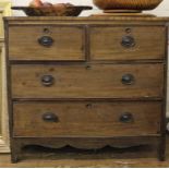 A Regency mahogany chest of two small and two large graduated drawers with oval brass drop handles