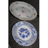 A Meissen porcelain dish with gilt edged wavy rim and crossed swords mark in blue, 24cm, and a