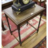 A late 19th century oak stained oblong occasional table with shaped top, plain frieze, raised on