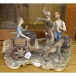 Capodimonte figurine  'La Vendemmia' depicting a gent, young boy and donkey on a stylized base, 30cm