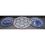 An 18th century Chinese wavy rim dish and two blue and white soup plates