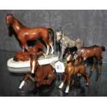 A continental pottery group of horse and foal, a studio pottery figurine of a foal and three Beswick