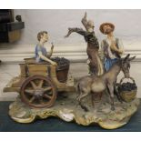 Capodimonte figurine  'La Vendemmia' depicting a gent, young boy and donkey on a stylized base, 30cm