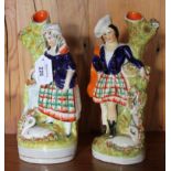 A large pair of 19th century Staffordshire flat backs of a man and woman carrying fish in baskets