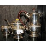 A four piece silver tea set