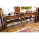 A pair of serpentine side tables, top drawers with ring handles and concave lower shelves, 83H x 92W