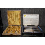 A boxed set of six Australian silver tea spoons and a boxed set of six knives