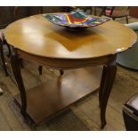 A cherry wood circular extending dining table (folding to console) 73cm x 110cm diameter (