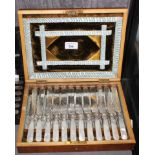 A cased set of 12 plated knives and forks with mother of pearl handles