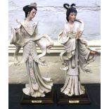 A pair of Capodimonte figures wearing Eastern dress, 35cm high