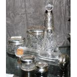 Two vanity jars with silver lids
