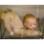 An Armand Marseille AM 351 doll, sleeping eyes on cloth body