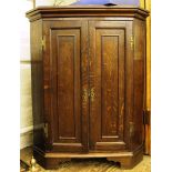 A stained oak standing corner cupboard with three shelves, 102H x 80W x 52cmD