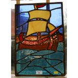 A stained glass panel depicting a sailing ship