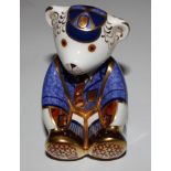 A Royal Crown Derby figure of a bear in school uniform, imari colours, 8.5cm high