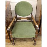 A nursing armchair with green upholstery