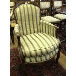 A Victorian French style armchair, curved framework with green, cream and gold upholstery