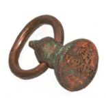 AN ANTIQUE POSSIBLY PERSIAN COPPER SEAL with looped handle 14.5cm tall