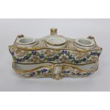 A 19TH CENTURY PORCELAIN DESK STAND OR ENCRIER, the boat shaped body with central pounce pot and ink